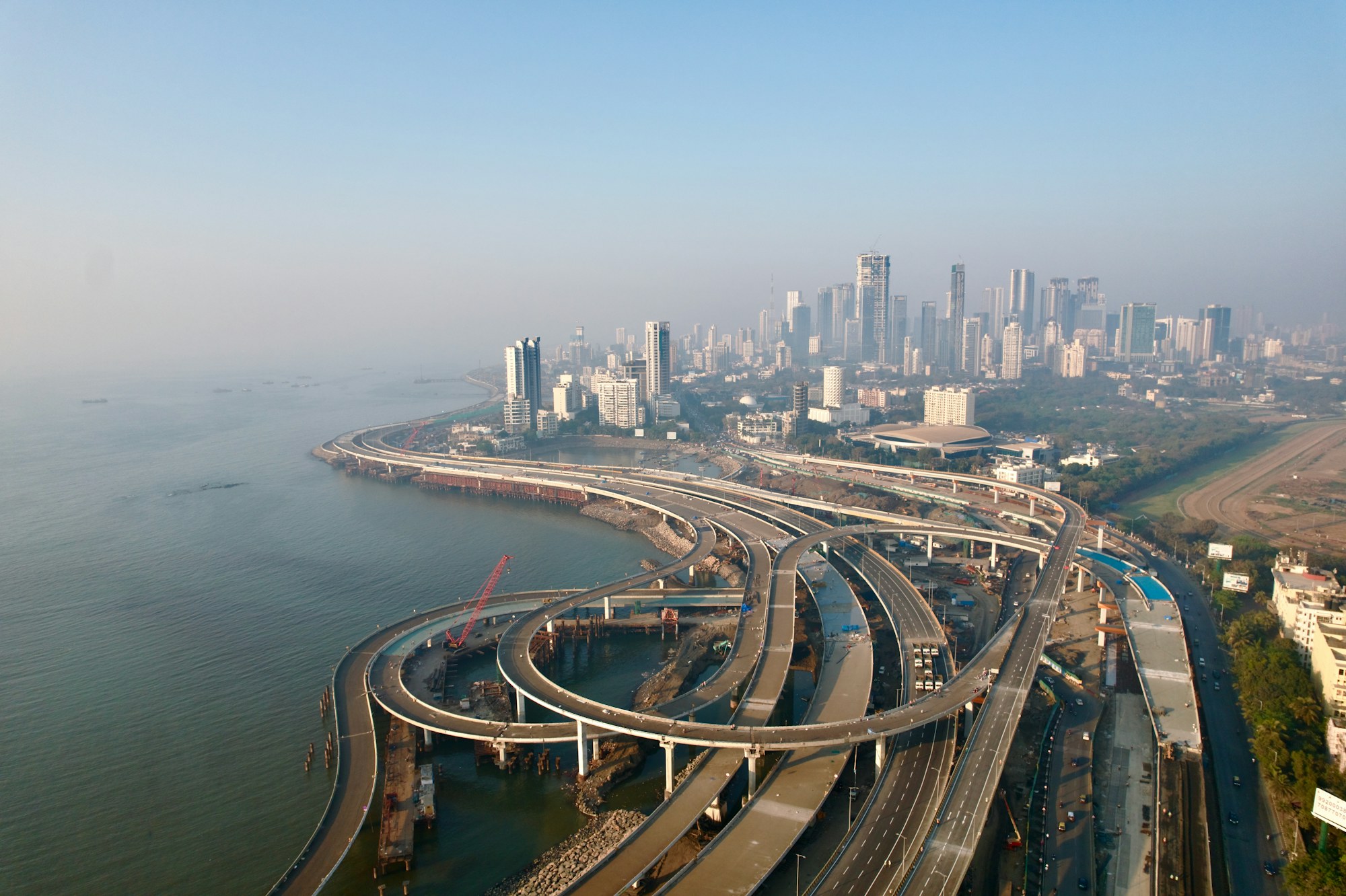 Aerial view of a major coastal highway infrastructure project